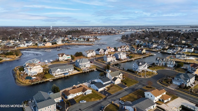 bird's eye view featuring a residential view and a water view