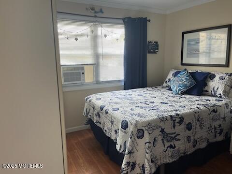 52 Fremont Ave Unit 3, Seaside Heights, NJ 08751 - bedroom with ornamental molding, wood finished floors, and cooling unit