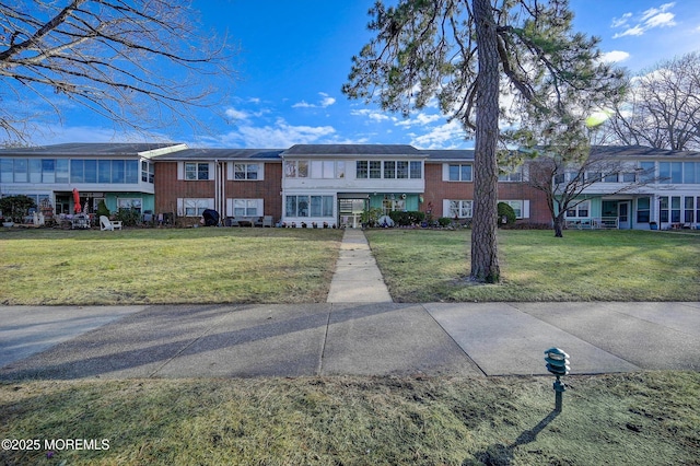 view of property with a front lawn