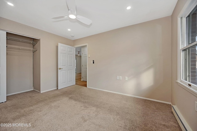 unfurnished bedroom with carpet, baseboards, baseboard heating, and recessed lighting