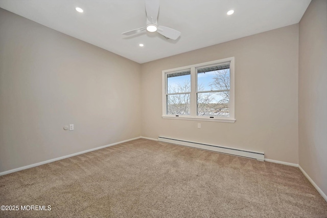 spare room featuring carpet floors, recessed lighting, a baseboard heating unit, ceiling fan, and baseboards