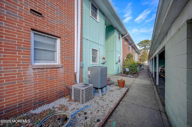 view of side of home featuring central AC unit