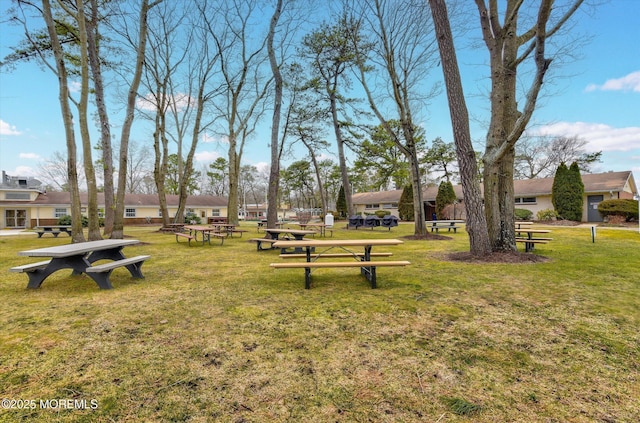 view of home's community with a lawn