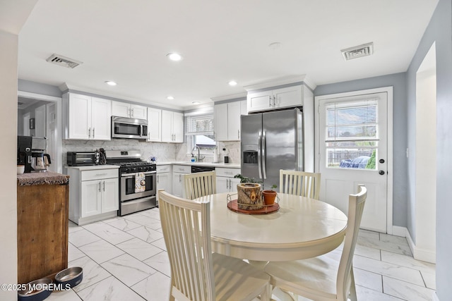12 Edgewater Dr, Matawan, NJ 07747 - dining area with light marble finish floors, baseboards, and recessed lighting