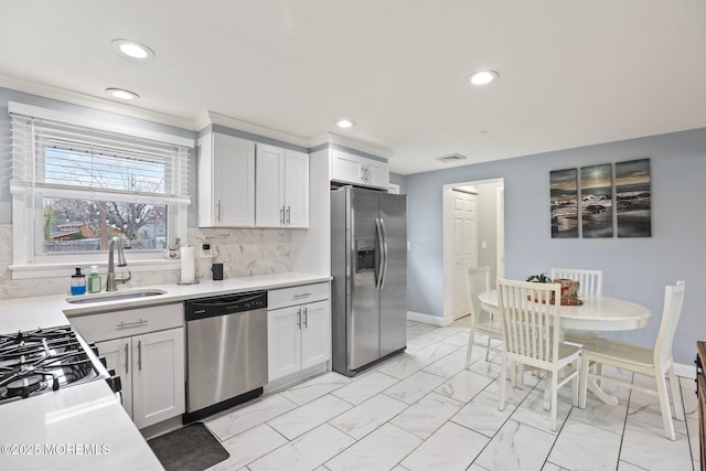 12 Edgewater Dr, Matawan, NJ 07747 - kitchen with appliances with stainless steel finishes, light marble finish floors, a sink, recessed lighting, and light countertops