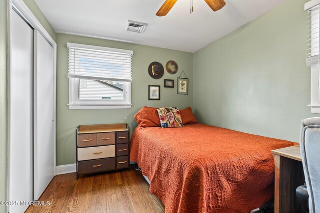 12 Edgewater Dr, Matawan, NJ 07747 - bedroom with dark wood finished floors, a closet, a ceiling fan, and baseboards