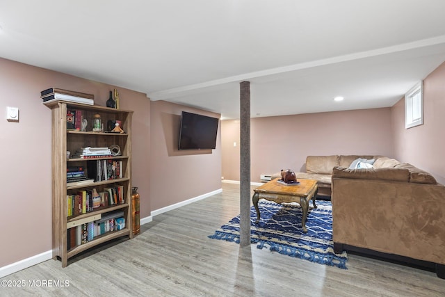 12 Edgewater Dr, Matawan, NJ 07747 - living room with wood finished floors, baseboards, and baseboard heating