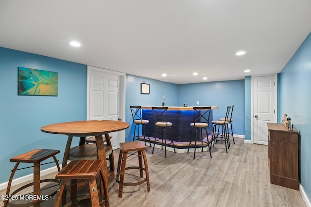 12 Edgewater Dr, Matawan, NJ 07747 - dining space featuring a bar, wood finished floors, baseboards, and recessed lighting
