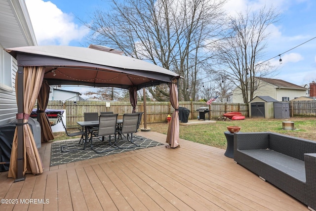 12 Edgewater Dr, Matawan, NJ 07747 - wooden deck with a gazebo, grilling area, outdoor dining area, and outdoor lounge area
