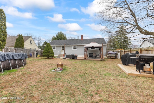 12 Edgewater Dr, Matawan, NJ 07747 - rear view of property featuring a gazebo, entry steps, and a chimney