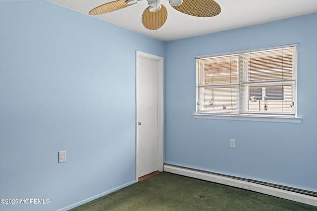 carpeted empty room with ceiling fan and a baseboard radiator