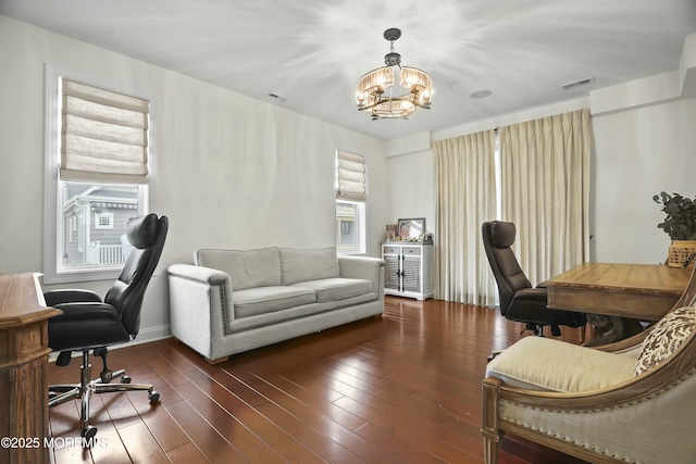 office area featuring dark wood-type flooring and a chandelier