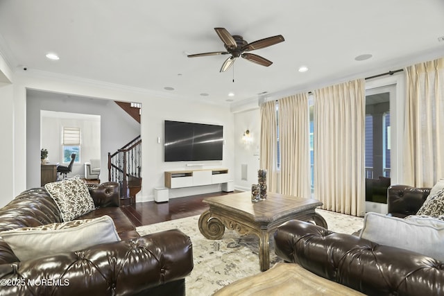 living room featuring ornamental molding, dark hardwood / wood-style floors, and ceiling fan