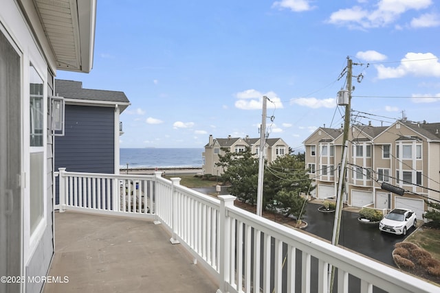 balcony featuring a water view