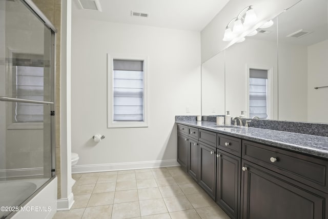 full bathroom with bath / shower combo with glass door, vanity, toilet, and tile patterned flooring