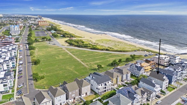 bird's eye view featuring a water view and a view of the beach