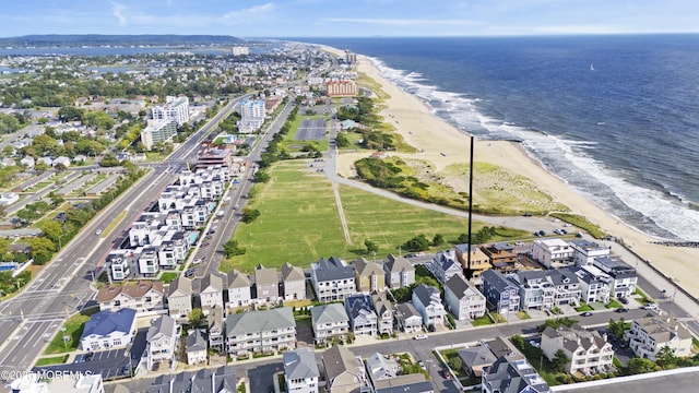 bird's eye view with a water view and a view of the beach