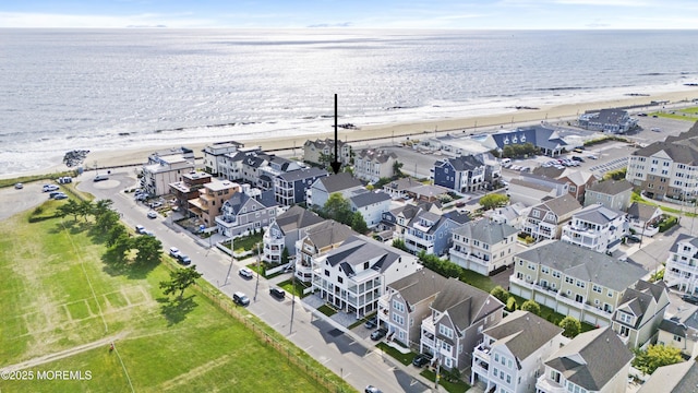 aerial view with a view of the beach and a water view