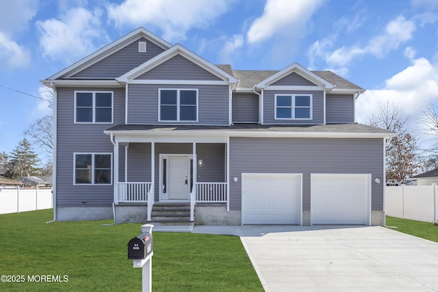 view of front facade with a garage, a front yard, and covered porch