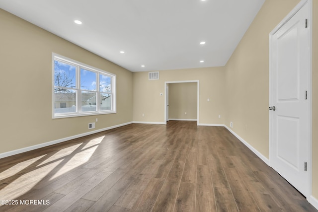 empty room featuring dark hardwood / wood-style floors