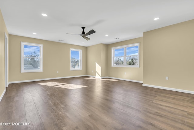 spare room with ceiling fan and hardwood / wood-style floors