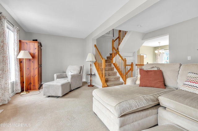 carpeted bedroom featuring a notable chandelier