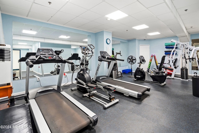 exercise room featuring a drop ceiling