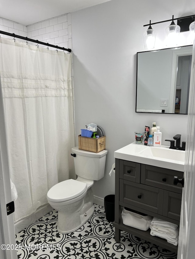 bathroom featuring tile patterned floors, curtained shower, toilet, and vanity