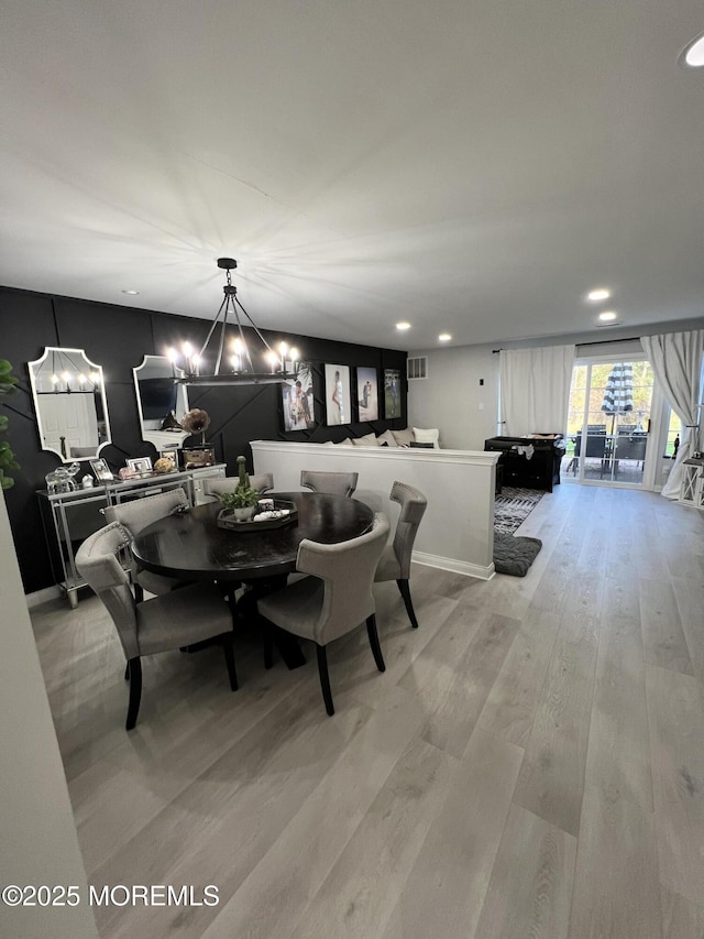 dining area featuring recessed lighting, visible vents, and light wood-style flooring