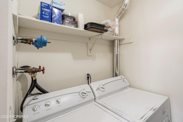 laundry area with washing machine and clothes dryer