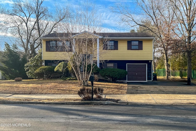 split foyer home featuring a garage