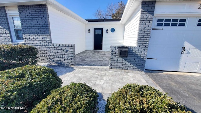 entrance to property featuring a garage