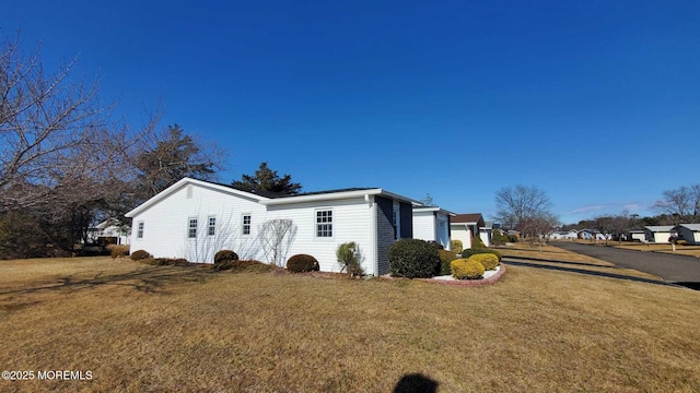 view of property exterior featuring a yard