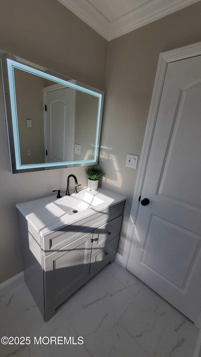 bathroom featuring vanity and crown molding