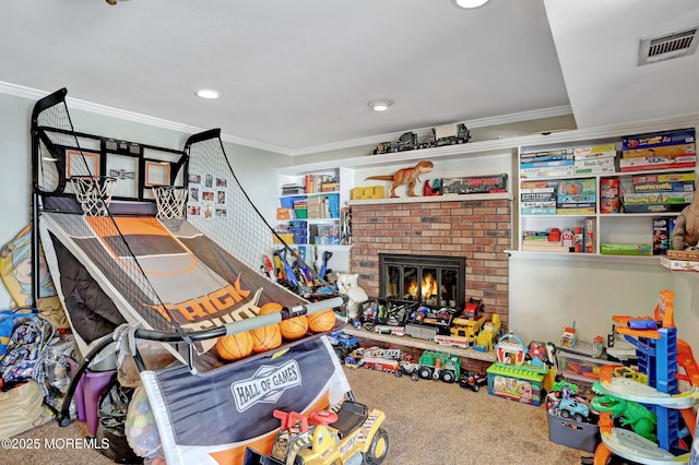 recreation room with carpet floors, crown molding, and a fireplace