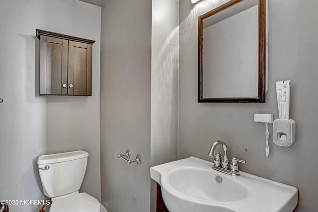 bathroom featuring sink and toilet