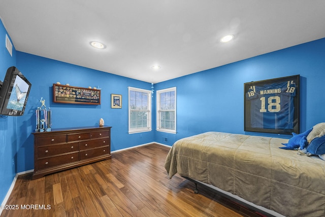 bedroom featuring recessed lighting, wood finished floors, and baseboards