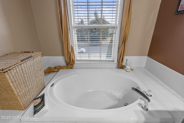 bathroom with a garden tub