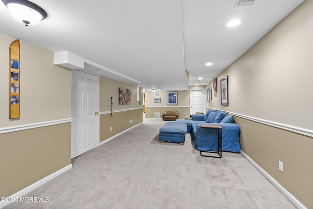 living room featuring carpet, baseboards, and recessed lighting