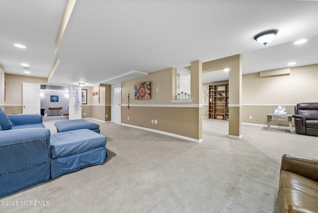 carpeted living area with baseboards and recessed lighting