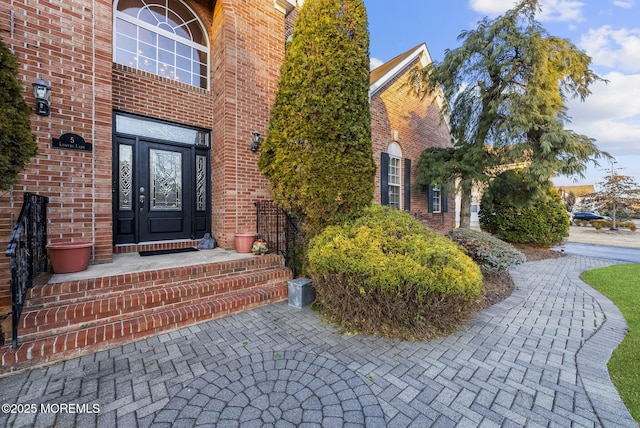 entrance to property with brick siding