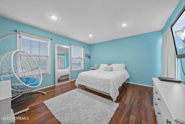 bedroom with dark wood-style floors, recessed lighting, and baseboards