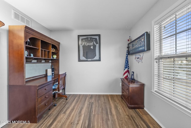 office area featuring wood finished floors, visible vents, and baseboards