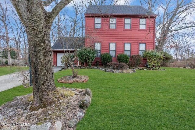 colonial-style house with a front yard