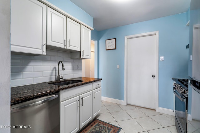 kitchen with a sink, white cabinetry, stainless steel dishwasher, backsplash, and gas range