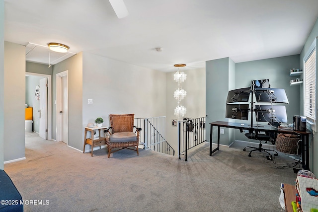 office area with carpet floors, attic access, baseboards, and an inviting chandelier