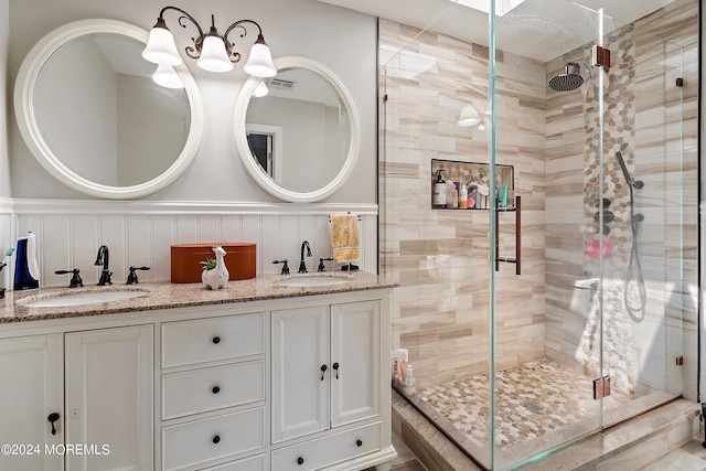 bathroom featuring vanity and an enclosed shower