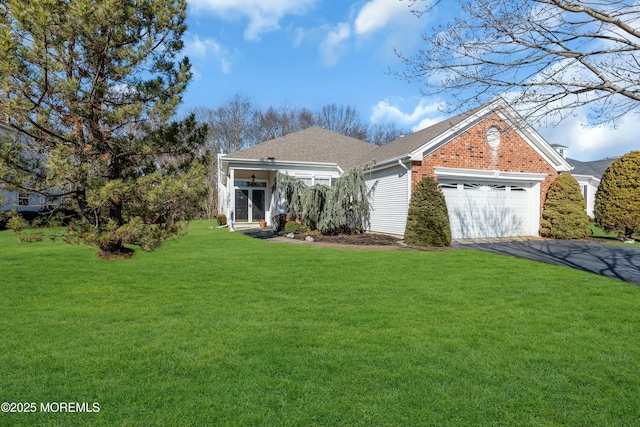 view of front of home featuring a garage and a front lawn