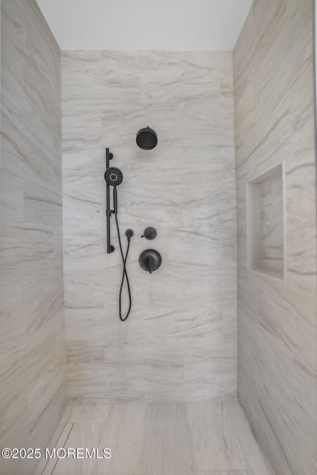 room details with a tile shower