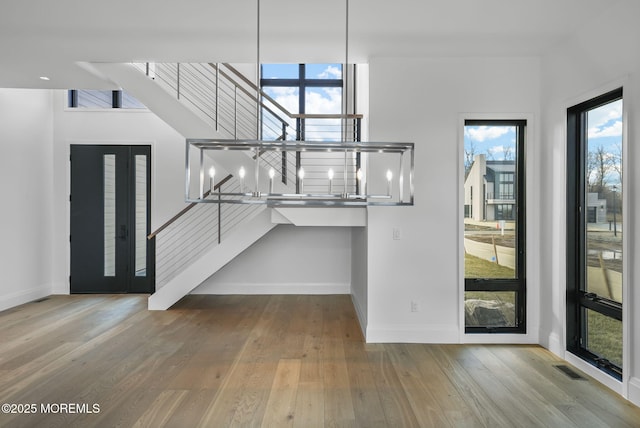 foyer entrance with light hardwood / wood-style floors